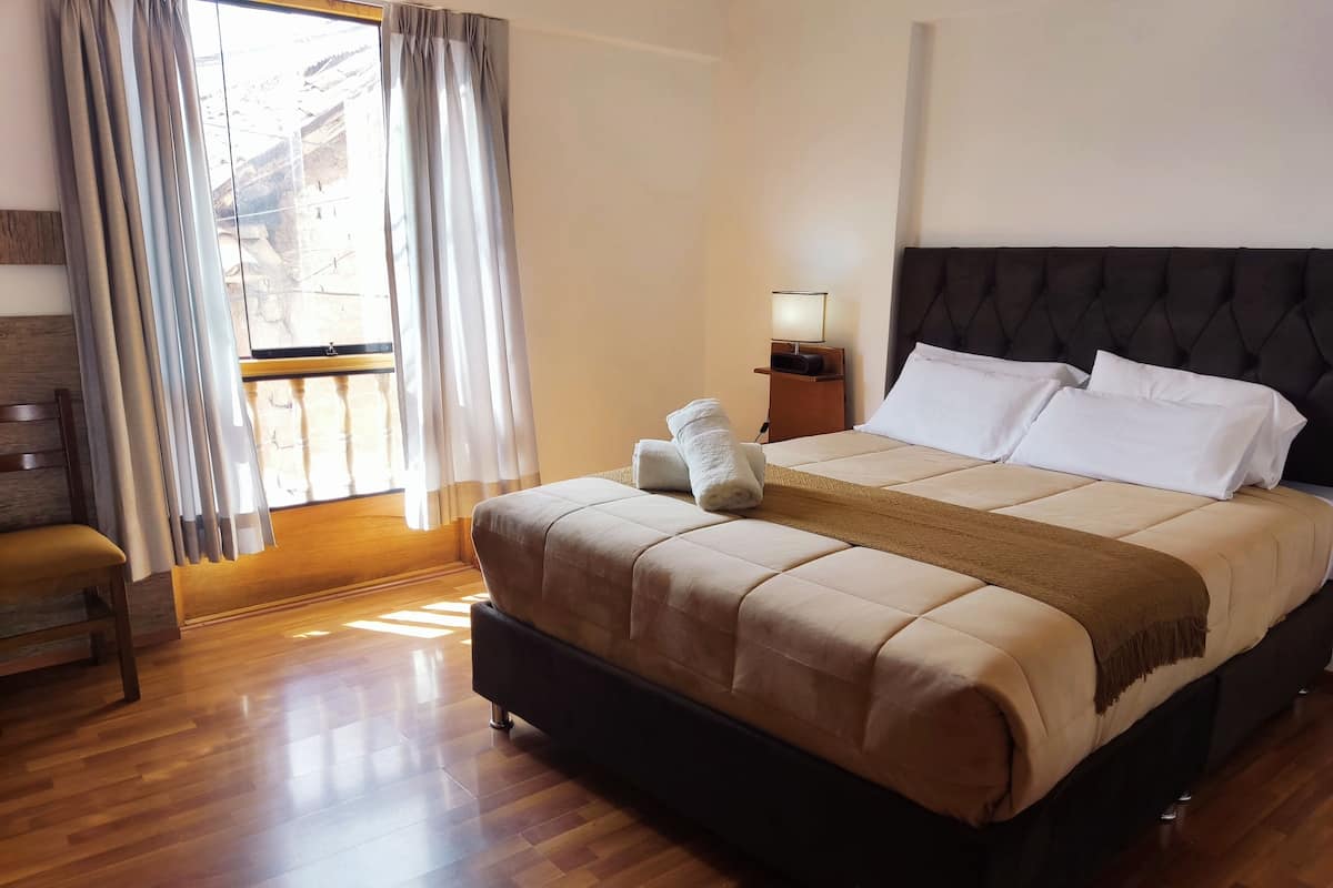 Habitación Deluxe | Ropa de cama de alta calidad y edredones de plumas