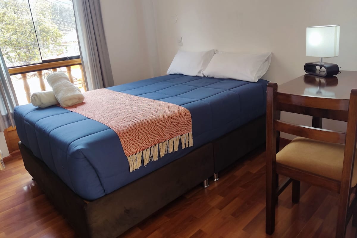 Habitación familiar | Ropa de cama de alta calidad y edredones de plumas