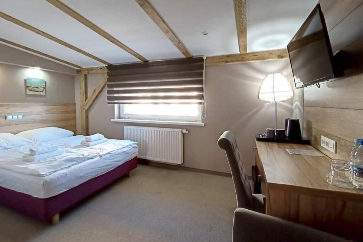 Memory-foam beds, desk, laptop workspace, blackout curtains