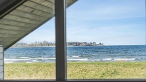 A view of the sea from a covered area with a grassy foreground. - Gorgeous home in Mesinge with WiFi (Mesinge)