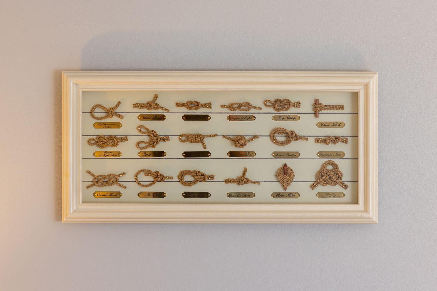 A framed display of various rope knots.