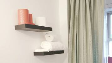 Hair dryer, towels, soap, shampoo