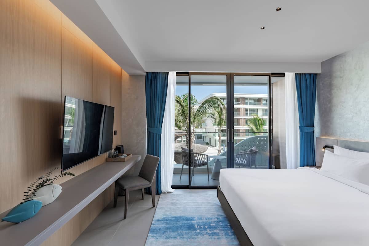 Premier Double or Twin Room, Balcony, Pool View | Minibar, in-room safe, desk, laptop workspace