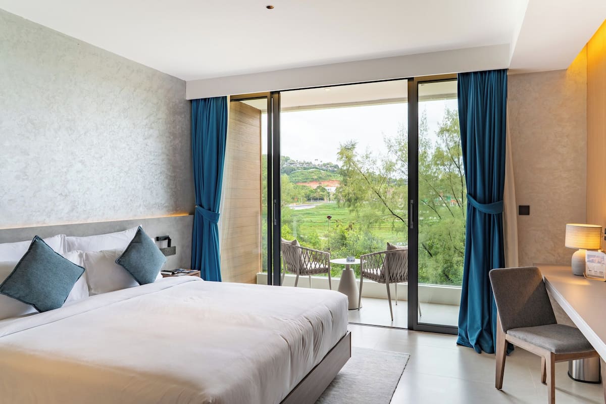 Deluxe Double or Twin Room, Balcony, Resort View | Minibar, in-room safe, desk, laptop workspace