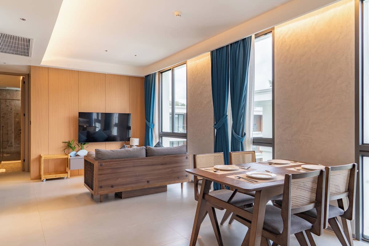 Grand Suite, 2 Bedrooms, Balcony, Pool View | Living area | 41-inch TV with digital channels, toys, computer monitors