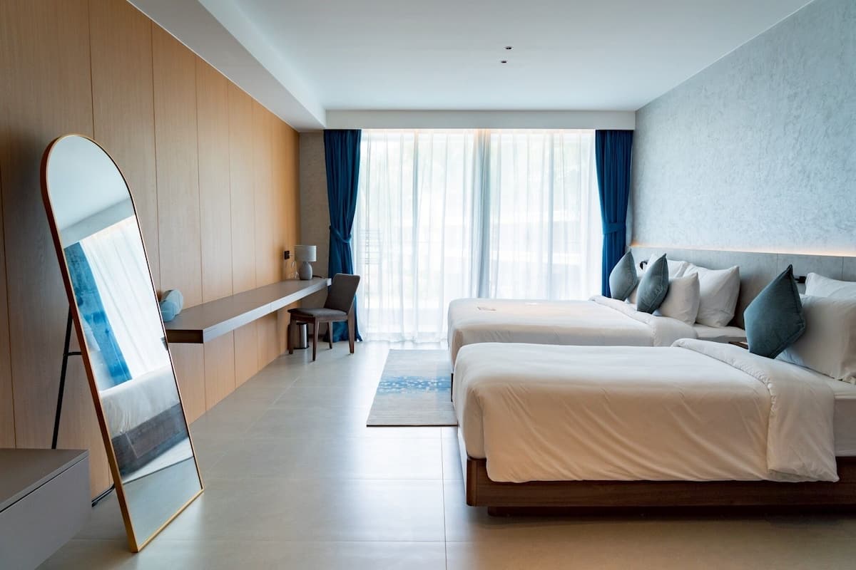 Premier Triple Room, Balcony, Sea View | Minibar, in-room safe, desk, laptop workspace