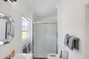 Shower, hair dryer, towels, toilet paper