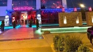A building with a sign reading "vermillion cinnabar" at the entrance, featuring large windows and a modern architectural style. - Traditonal House - Etihad -Games Room-Free Parking (Manchester)