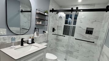 Shower, hair dryer, towels, soap