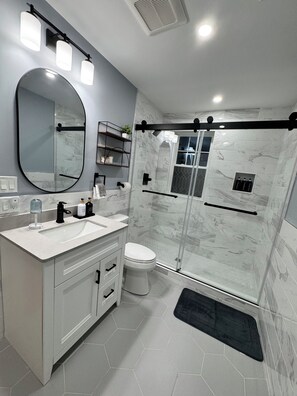 Shower, hair dryer, towels, soap