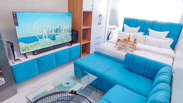 Luxury Studio Suite, City View | Living area | 24-inch Smart TV with digital channels