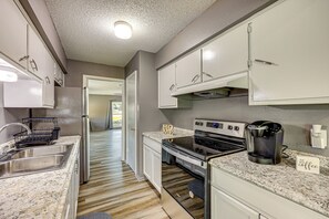 Fridge, microwave, stovetop, coffee/tea maker