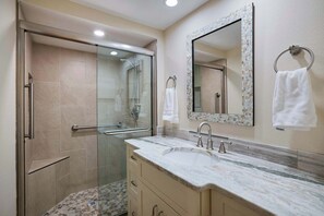 Shower, hair dryer, towels, shampoo