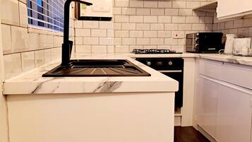 Microwave, oven, cookware/dishes/utensils