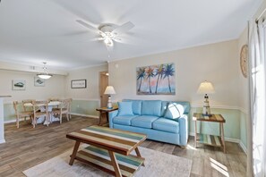 Signature Condo, 2 Bedrooms, Balcony, Garden View | Living room | 55-inch Smart TV with cable channels, fireplace - Colony Club H6 (Gulf Shores)