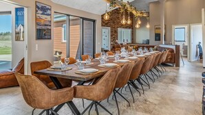 A spacious dining area with a long table set for a meal, surrounded by comfortable seating. - "Sönke" - 4km from the sea by Interhome (Rømø)