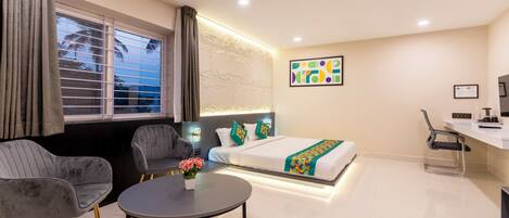 Deluxe Room | Individually furnished, desk, blackout drapes, iron/ironing board