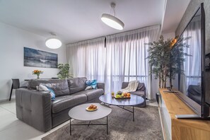 Condo, Beach View | Living area | 55-cm Smart TV with cable channels