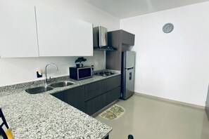 Fridge, microwave, stovetop, coffee/tea maker