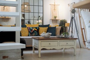 Superior Suite, Balcony | Living room | 45-inch flat-screen TV with digital channels