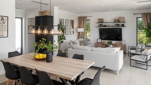 A modern living room with a sofa, TV, and dining area with chairs and a table. - Villa with pool and wellness for 8 persons, 4 bedrooms,  (Poreč)