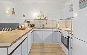 Fridge, stovetop, dishwasher, coffee/tea maker