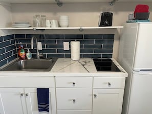 Fridge, microwave, stovetop, coffee/tea maker