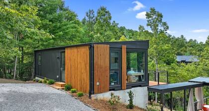 Modern 1BR container cabin with private deck, hammock, and fire pit. Surrounded by peaceful forest, it’s the perfect cozy escape for slow mornings, fresh air, and relaxed evenings in the mountains.