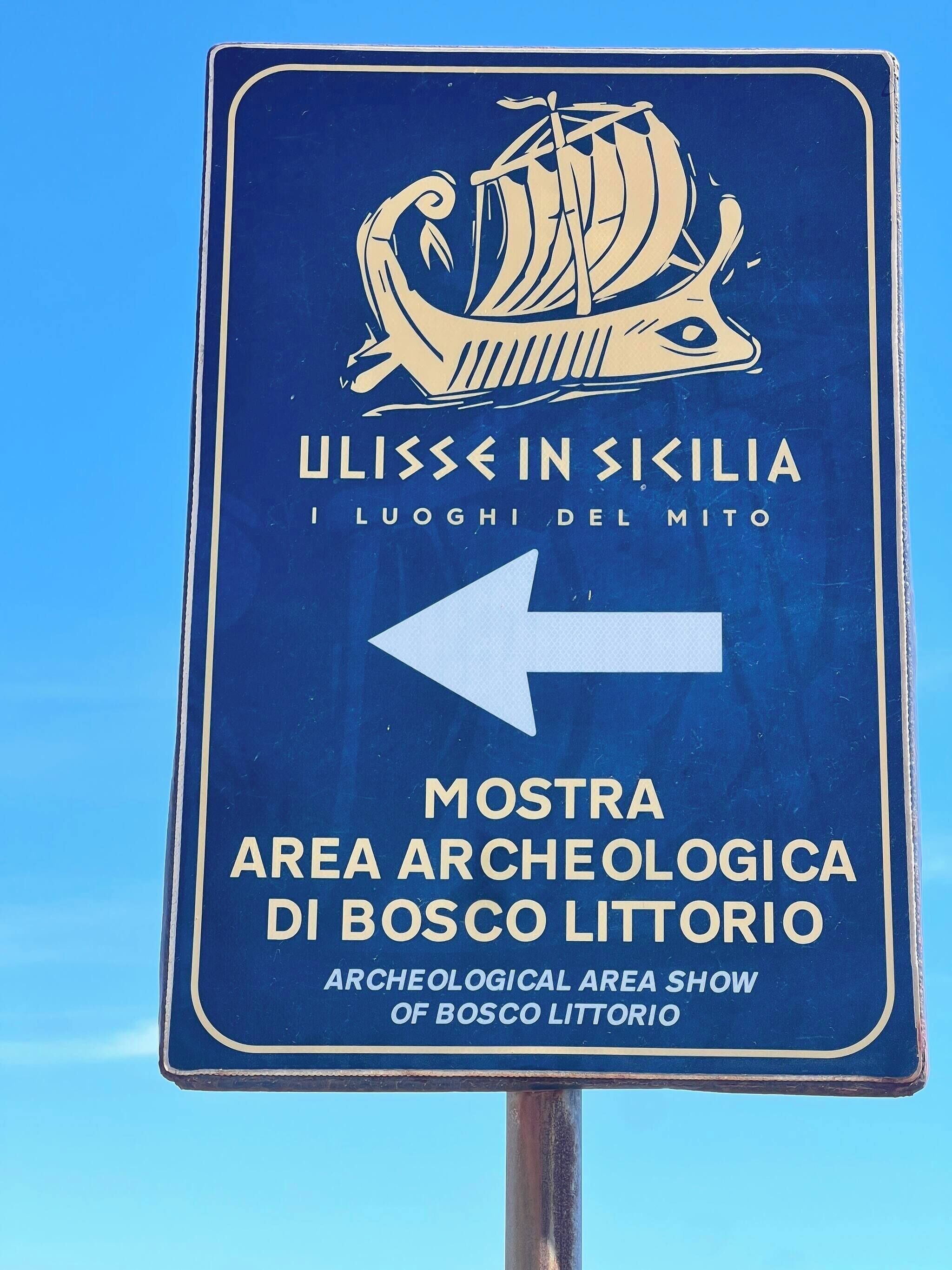A sign for the Archaeological Area Show of Bosco Litorio.