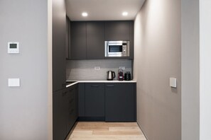 Fridge, microwave, stovetop, coffee/tea maker