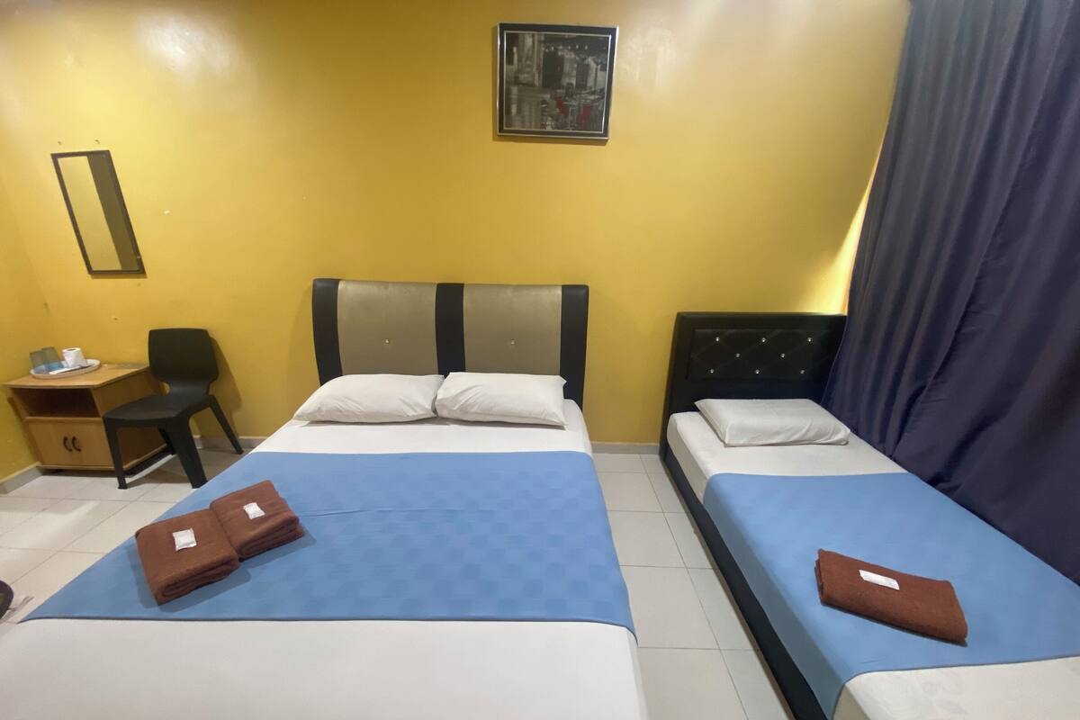 Habitación triple estándar | Ropa de cama