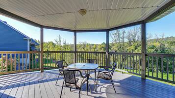 Relax in this serene outdoor space with a glass-top table and four comfortable chairs.