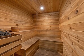A wooden sauna with benches and a bench seat, a wooden bench, and a wooden bench seat.