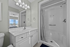 Shower, hair dryer, towels, toilet paper