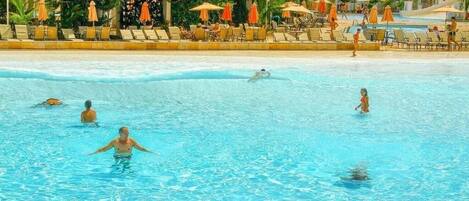 12 outdoor pools, a heated pool, pool umbrellas, pool loungers