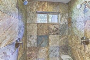Shower, hair dryer, towels, shampoo