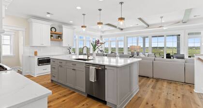 Here Comes the Sunset is a gorgeous home with incredible views of the Sunset Beach Intercoastal waterway and just a short walk to the beach!