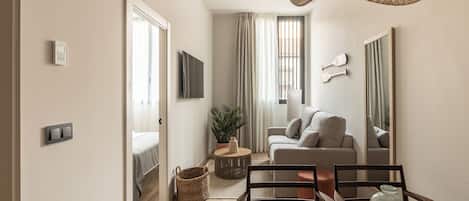 Apartamento, 1 quarto | Área de estar