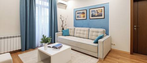 Appartement Deluxe, vue ville | Coin séjour