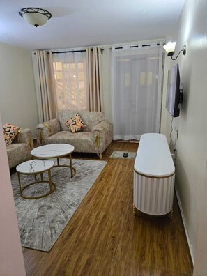 Comfort Apartment, Balcony, City View | Living area - Lux Suites Astrol Apartments Garden City (Nairobi)
