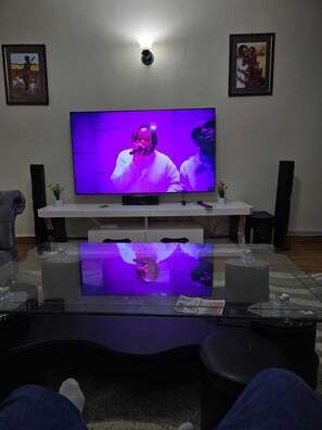 Family Apartment, City View | Living area | 24-inch Smart TV with digital channels - Lux Suites Astrol Apartments Garden City (Nairobi)