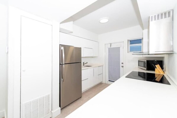 Deluxe Apartment, 2 Bedrooms | Private kitchen | Full-sized fridge, microwave, oven, stovetop