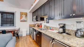 Fridge, microwave, coffee/tea maker, cookware/dishes/utensils