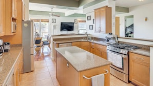A modern kitchen with granite countertops, stainless steel appliances, wooden cabinets, and a central island. - Spacious 3BR/2.5BA Home • 2800 sq ft • Mountain Views & Prime Location. PRIVATE. (Newbury Park)