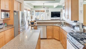 A modern kitchen with granite countertops, wooden cabinets, a built-in oven, a gas stove, and a dishwasher. - Spacious 3BR/2.5BA Home • 2800 sq ft • Mountain Views & Prime Location. PRIVATE. (Newbury Park)