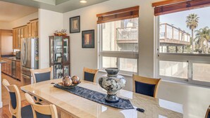 A dining area with a marble table, chairs, a decorative bowl, and a cabinet. - Spacious 3BR/2.5BA Home • 2800 sq ft • Mountain Views & Prime Location. PRIVATE. (Newbury Park)