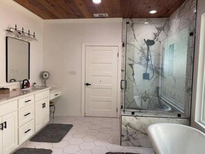 Shower, hair dryer, towels, toilet paper