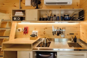 Mini-fridge, stovetop, cookware/dishes/utensils, paper towels