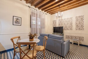 Apartment, 1 Bedroom | Living area | 65-inch TV with cable channels - Casa Museo La Merced by Stay Unique (Málaga)