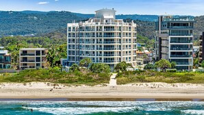 A coastal hotel with multiple floors, a beach view, and a water tower. - Surf Watch Palm Beach (Palm Beach)